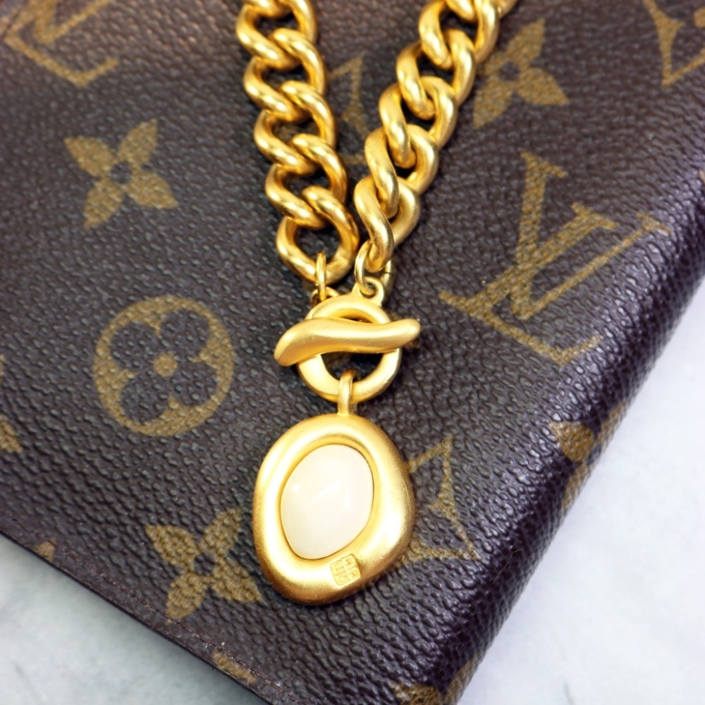 Givenchy Gold Plated Chunky Bracelet with Toggle Clasp and Logo Milk Pendant EUC